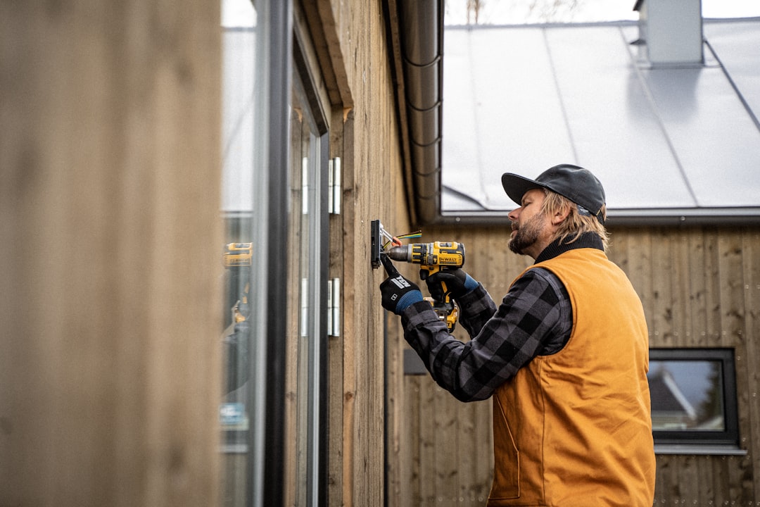 Professional contractor reviewing roof inspection and materials in office setting